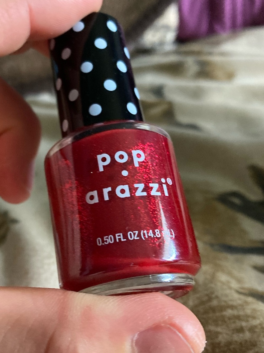 Red sparkly nail polish